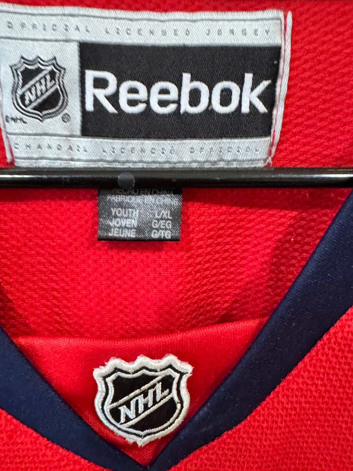 Reebok T.J. Oshie Washington Capitals red home jersey featuring his number 77 size youth L/XL