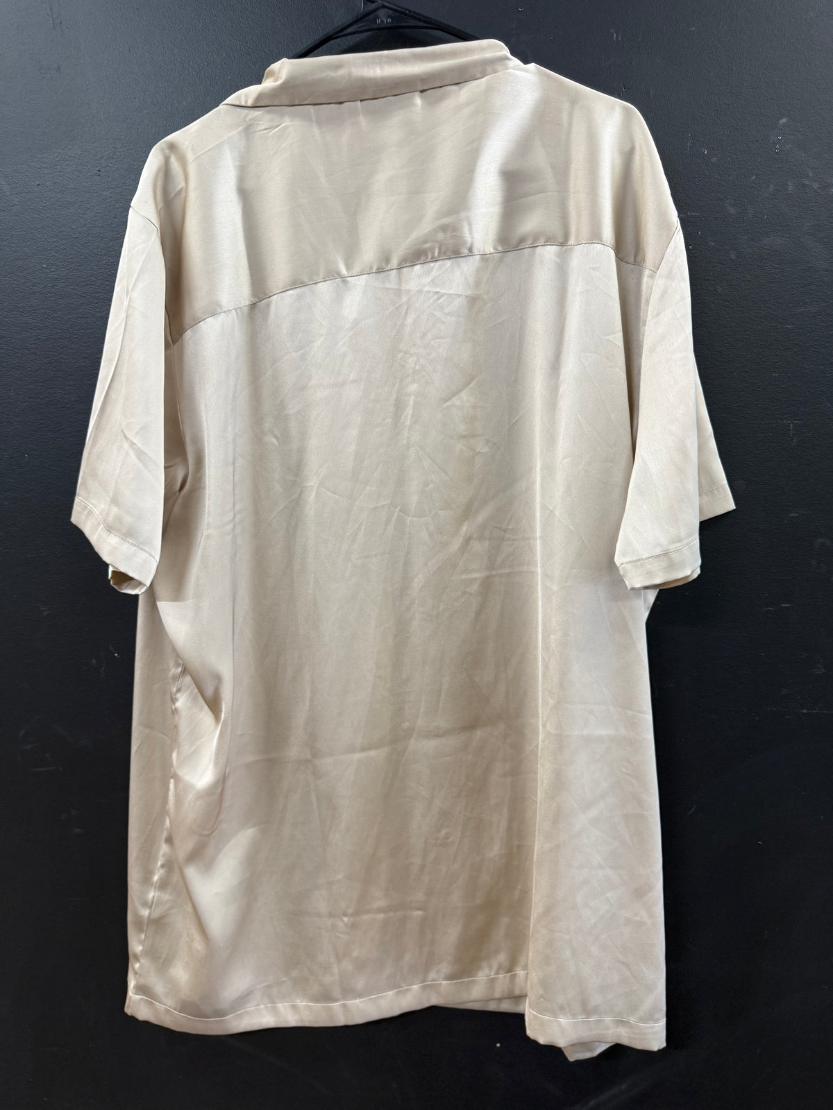 ASOS DESIGN short-sleeve satin camp-collar shirt in a smooth champagne hue.
