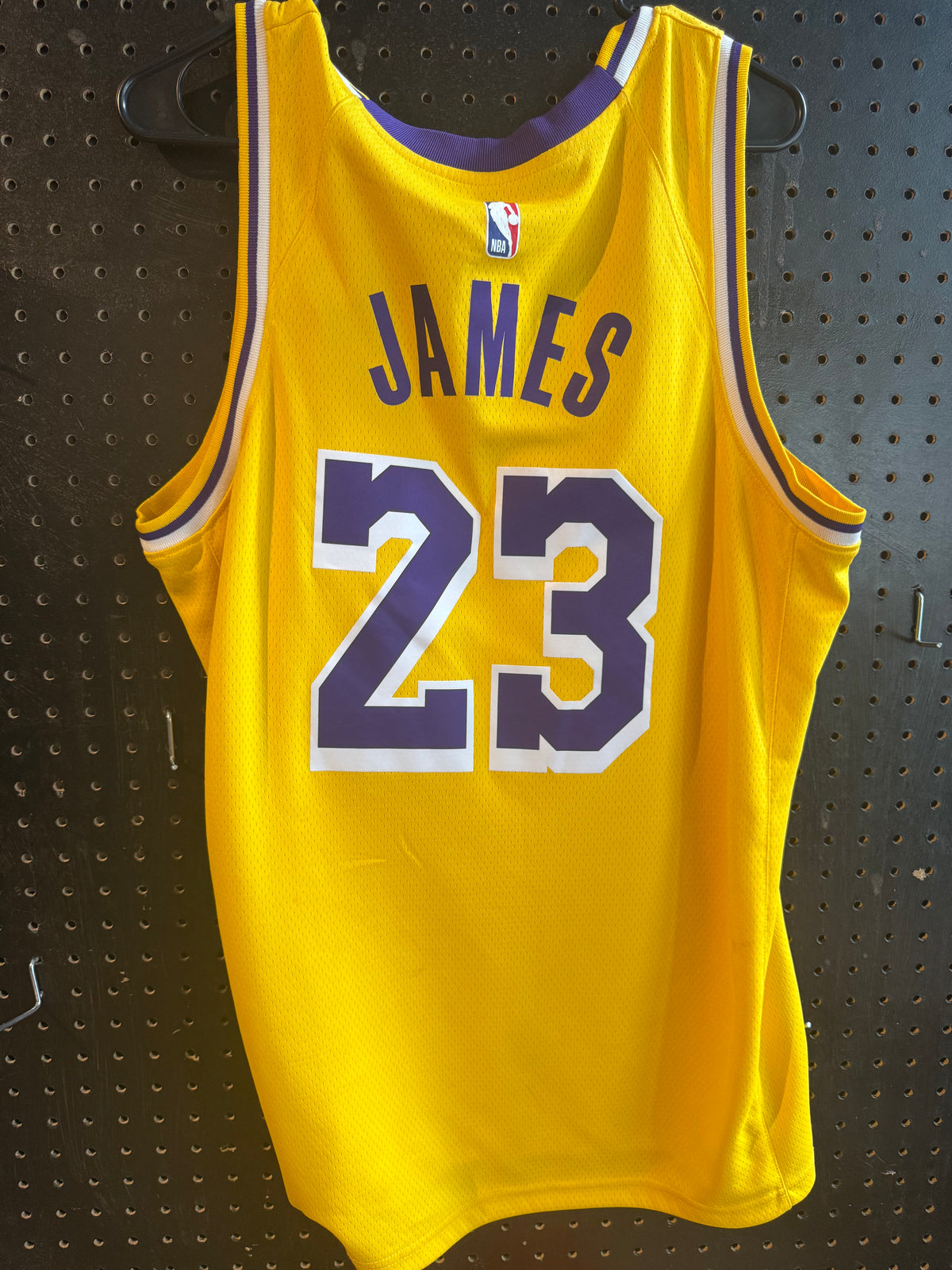 Nike LeBron James Los Angeles Lakers Icon Swingman Jersey, featuring gold mesh material and purple and white details size 48