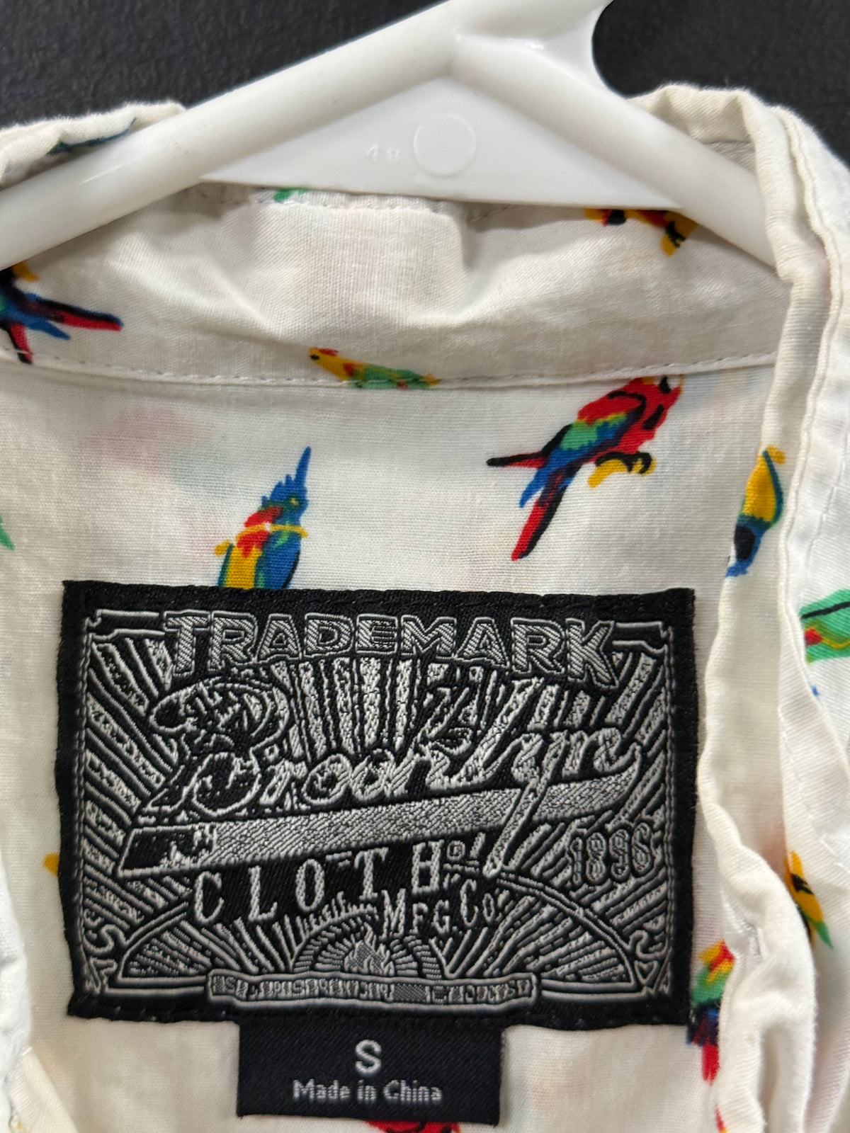 Brooklyn Cloth short-sleeve button-down shirt size small featuring colorful tropical parrot pattern.