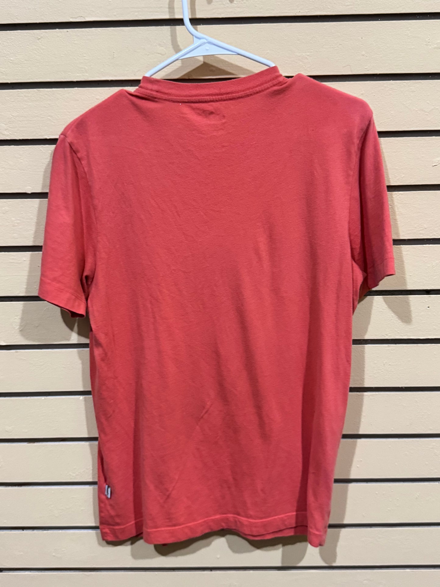 Puma Essentials Heather Men's Tee in High Risk Red size small featuring a large graphic logo on the chest.