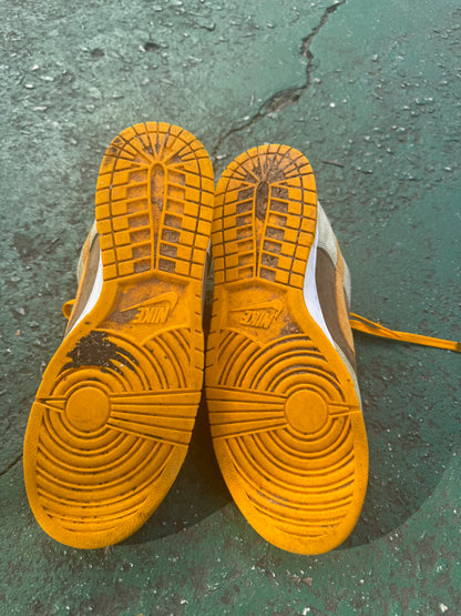 Nike Dunk Low 'Dusty Olive,' size 12 featuring a rustic brown suede base with olive overlays and bright orange laces.