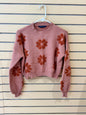 Simply Southern brand women’s Floral Rust Cropped Sweater size large featuring a dusty pink knit fabric and dark orange flower motifs.