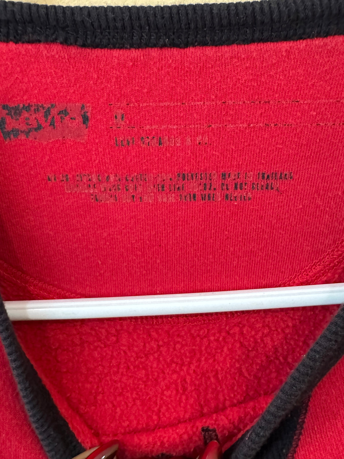 red Levi's crewneck size large sweatshirt featuring a black graphic of a skull in a hat and "Denim Suppliers" text.