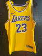 Nike LeBron James Los Angeles Lakers Icon Swingman Jersey, featuring gold mesh material and purple and white details size 48