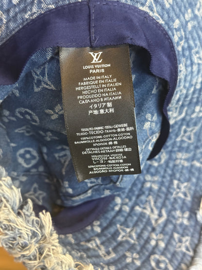 LV Monogram Denim bucket hat features a blue monogram pattern and frayed edges
