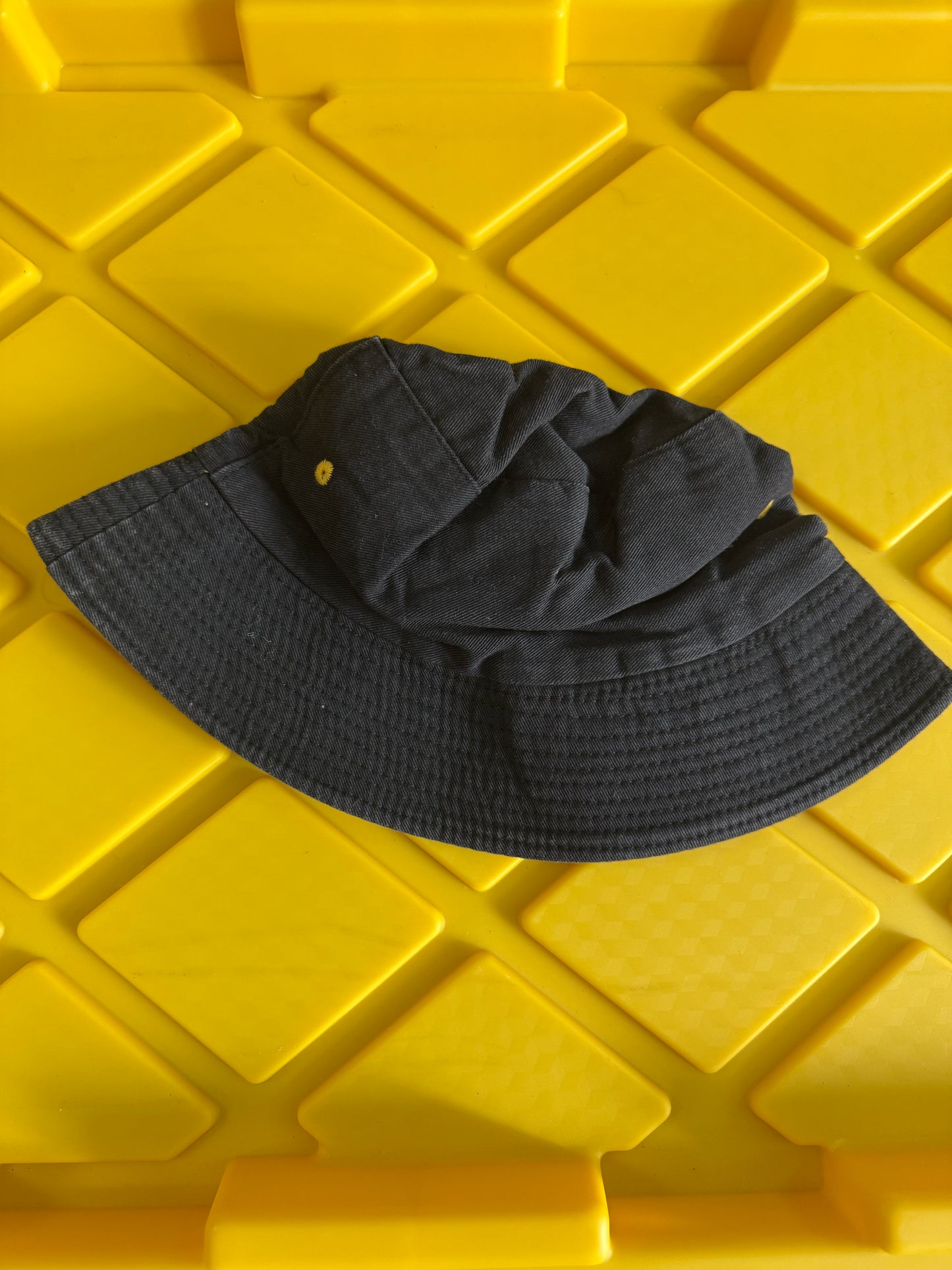 black The Hype House reversible bucket hat featuring a colorful embroidered logo on the front panel