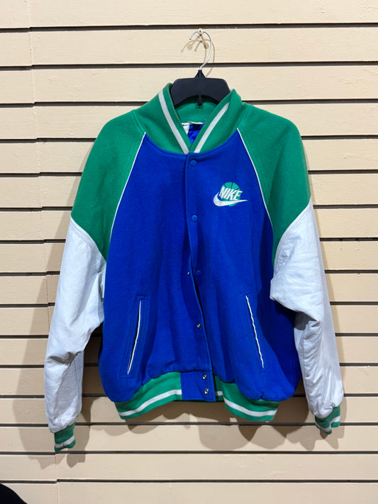 Vintage 1990s Nike Force Basketball varsity jacket featuring blue and green color blocking with embroidered "FORCE" lettering on the back. Size Large