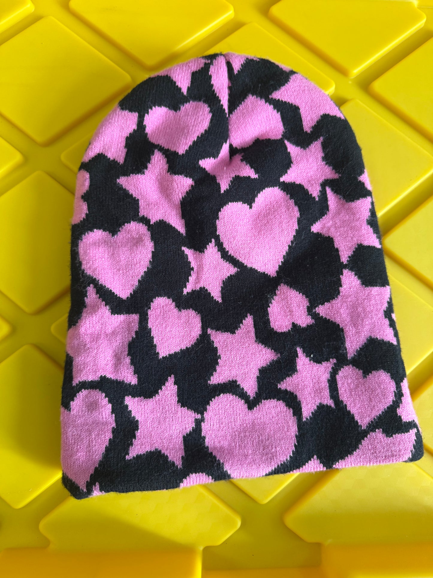 Black & Pink Beanie black knit fabric pattern of pink hearts and stars