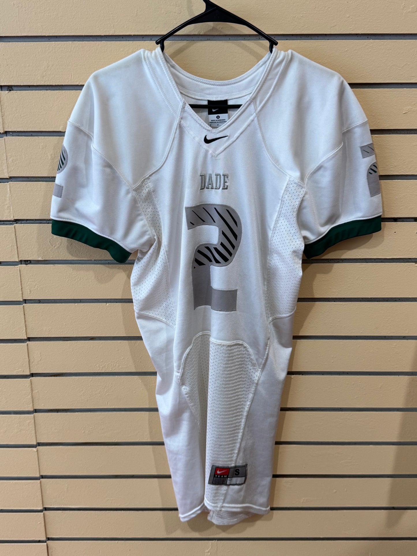 Nike Miami Dade white football jersey size small featuring the number 2 and green sleeve cuffs