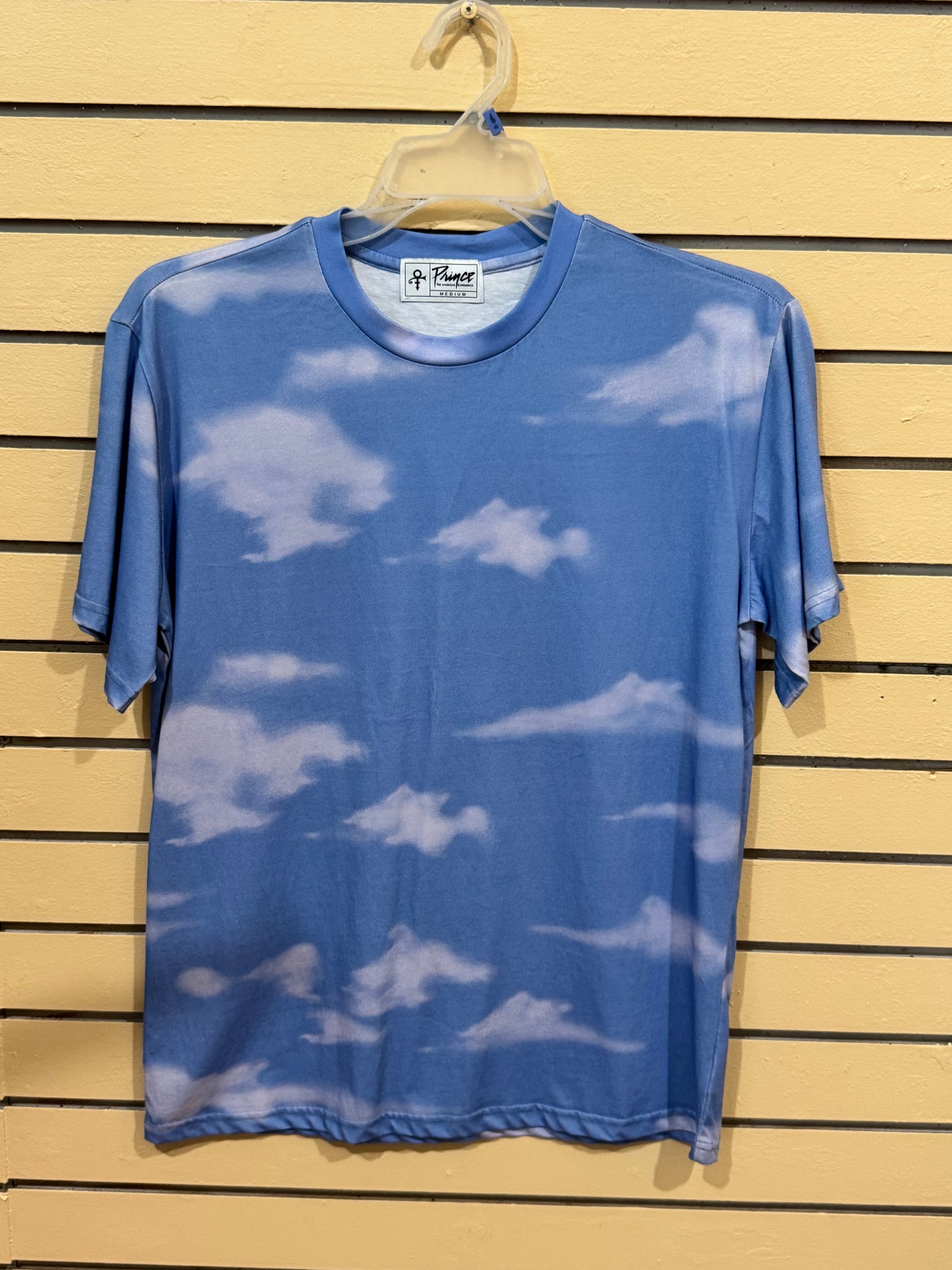 Official Prince merchandise blue sky and white clouds all-over print crew neck t-shirt size medium featuring the iconic Love Symbol on the inner neck label.