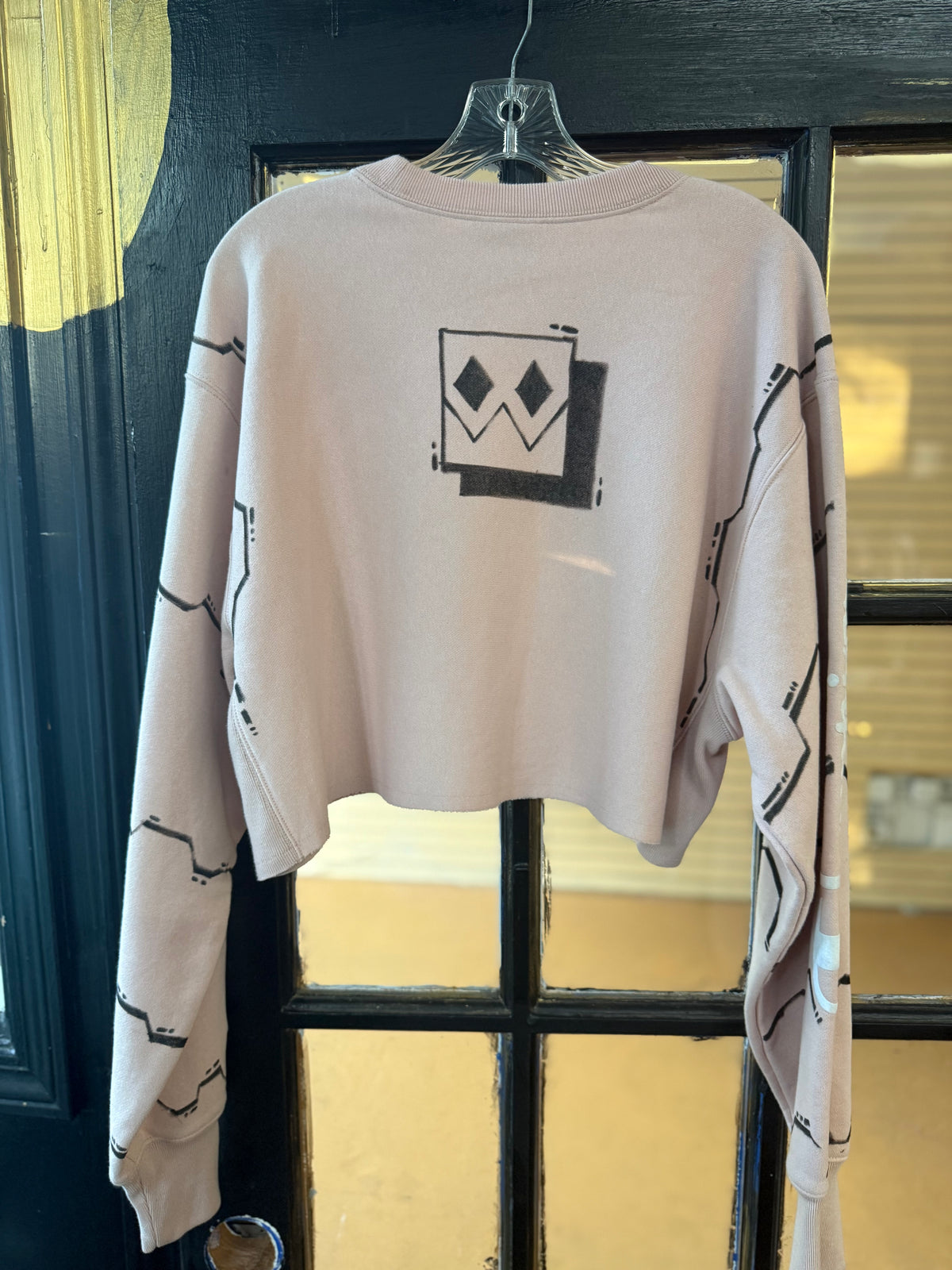 Champion Light Pink cropped crewneck sweatshirt, featuring an all-over black-and-white comic book panel manga sketch