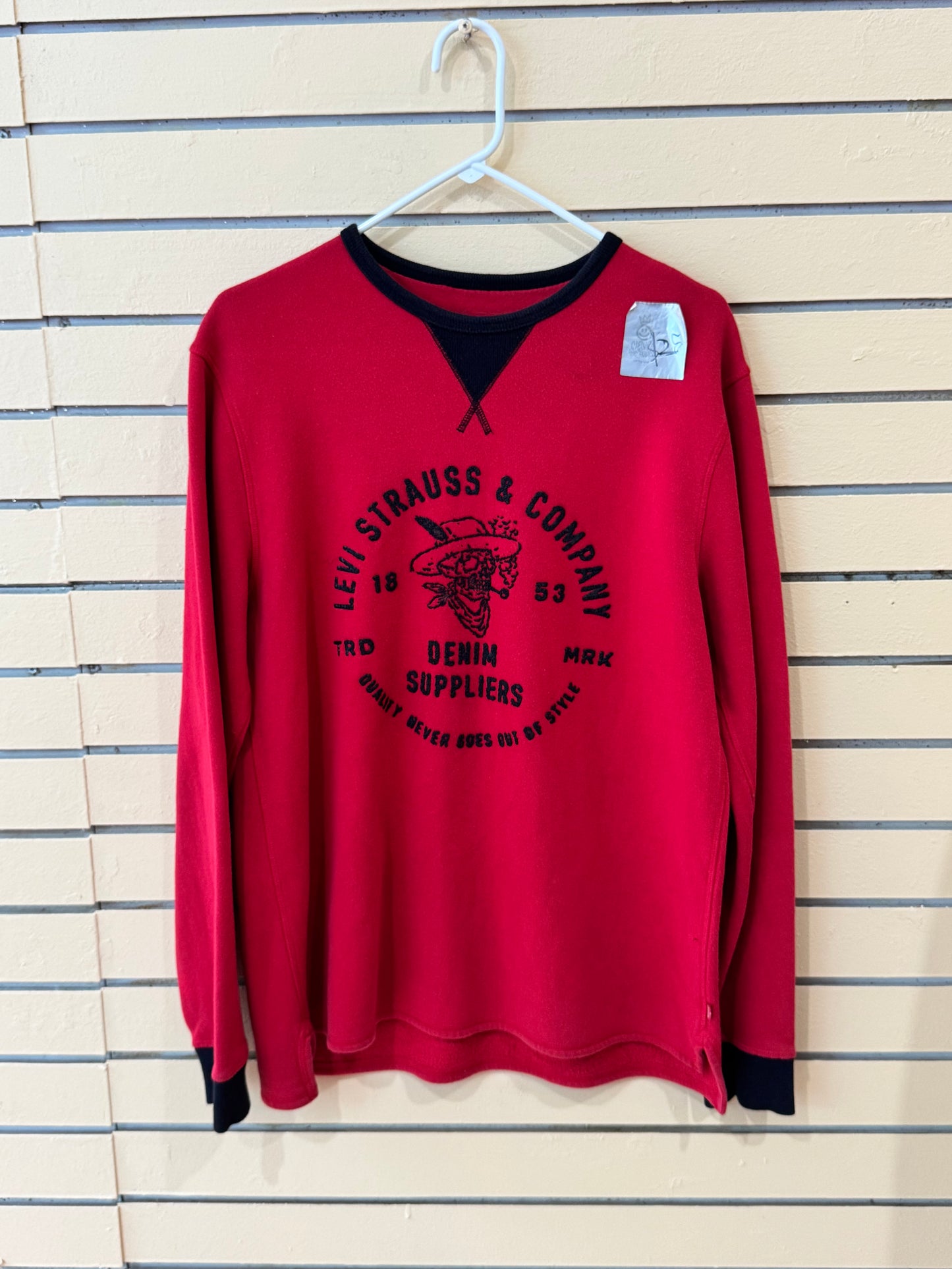red Levi's crewneck size large sweatshirt featuring a black graphic of a skull in a hat and "Denim Suppliers" text.