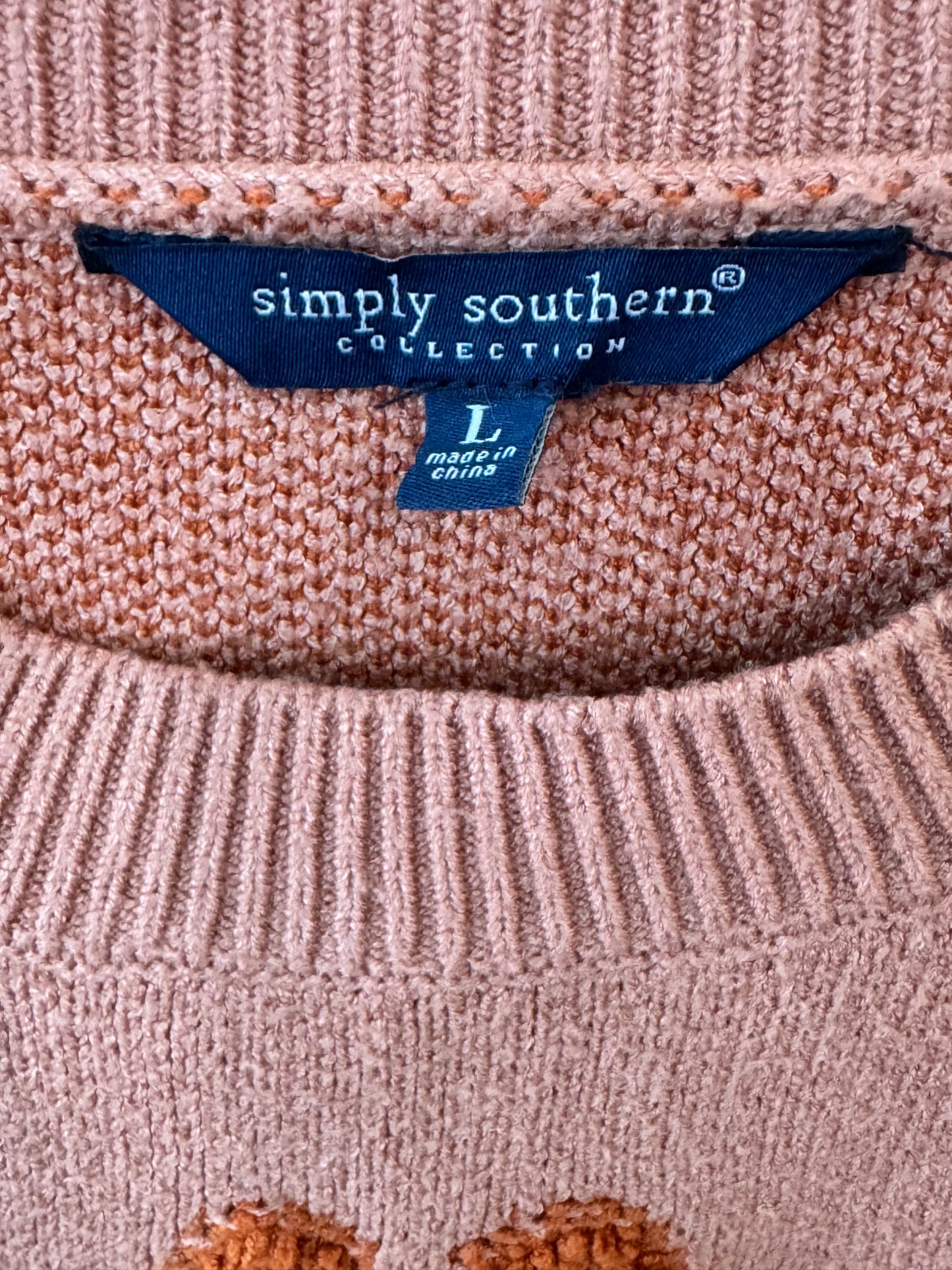 Simply Southern brand women’s Floral Rust Cropped Sweater size large featuring a dusty pink knit fabric and dark orange flower motifs.