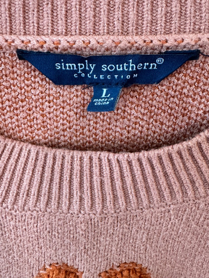 Simply Southern brand women’s Floral Rust Cropped Sweater size large featuring a dusty pink knit fabric and dark orange flower motifs.