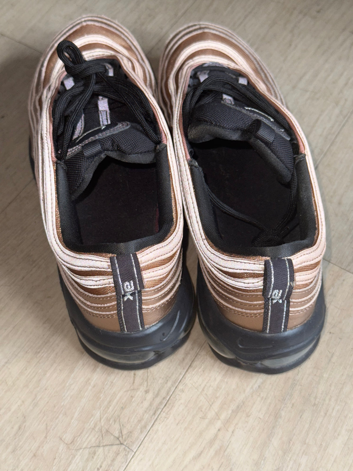 Nike Air Max 97 in "Copper" or "Metallic Red Bronze" features a distinctive metallic finish size 10