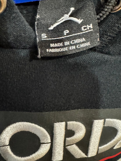 black Air Jordan crop hoodie size small features a distressed, raw-edge hem and prominently displays the iconic Jumpman logo over the number "23"