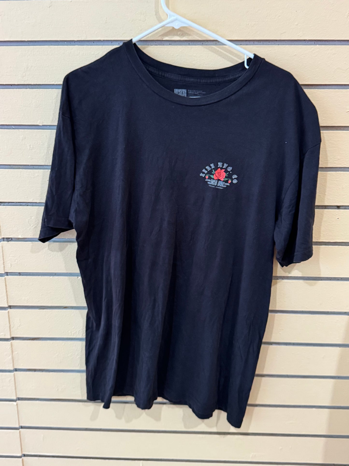 Black graphic tee from Lira Clothing size large rose-in-a-bottle design on the back.