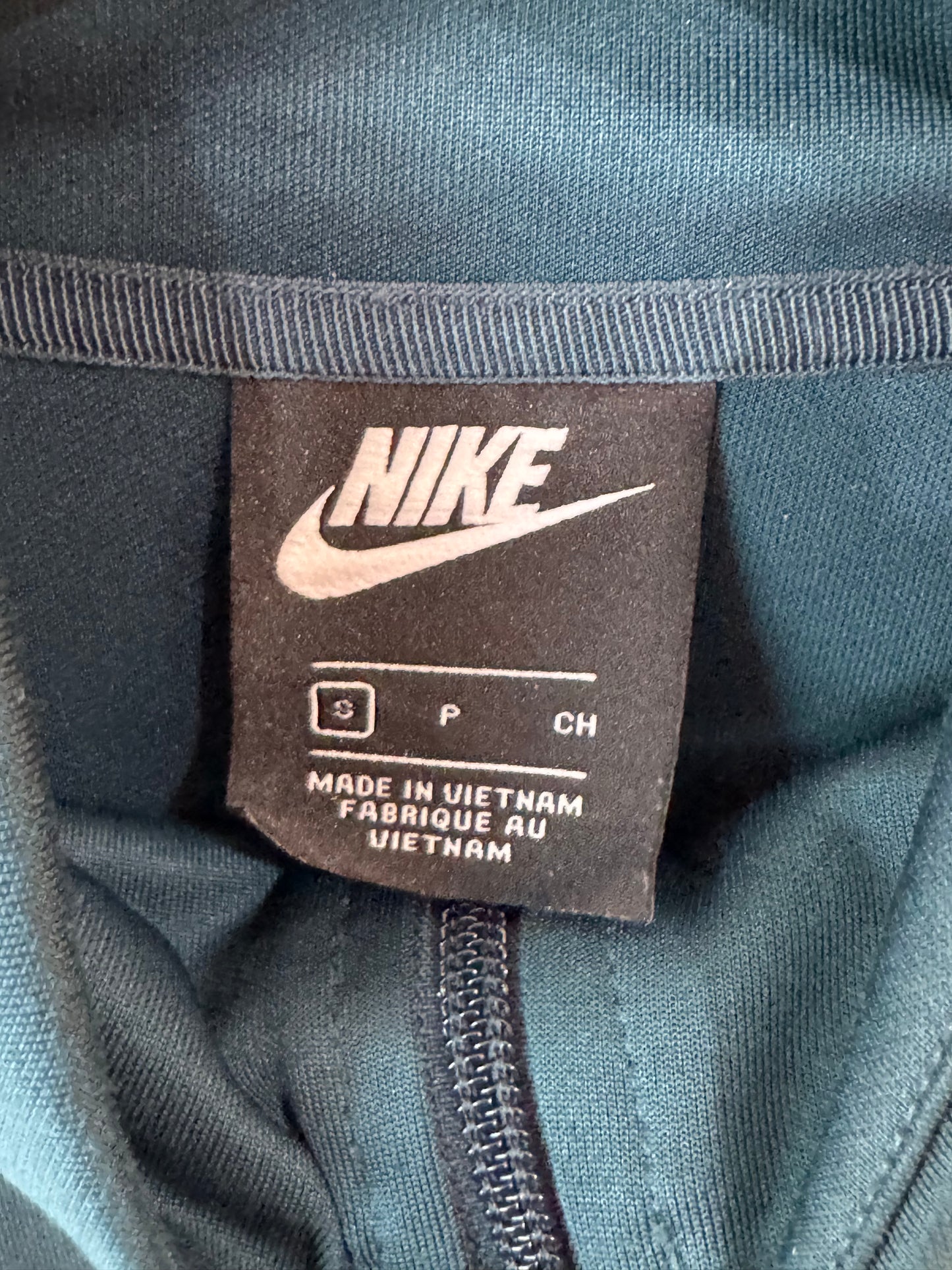 Nike Tribute track jacket size small teal body with red and white stripe accents along the sleeves.