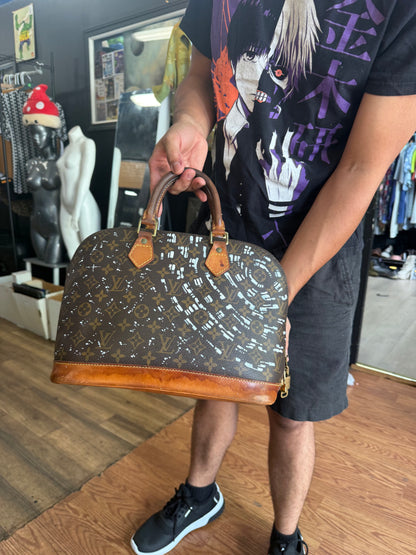 The Custom Authentic 1 of 1 Louis Vuitton Monogram Alma handbag is a luxurious and iconic piece