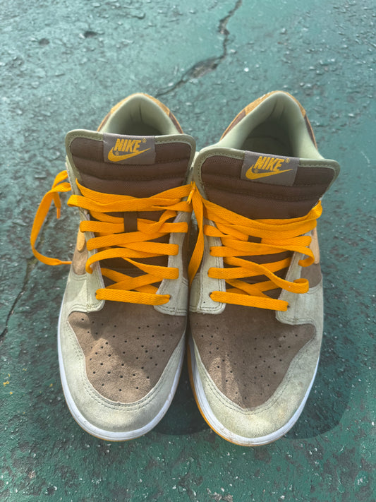 Nike Dunk Low 'Dusty Olive,' size 12 featuring a rustic brown suede base with olive overlays and bright orange laces.