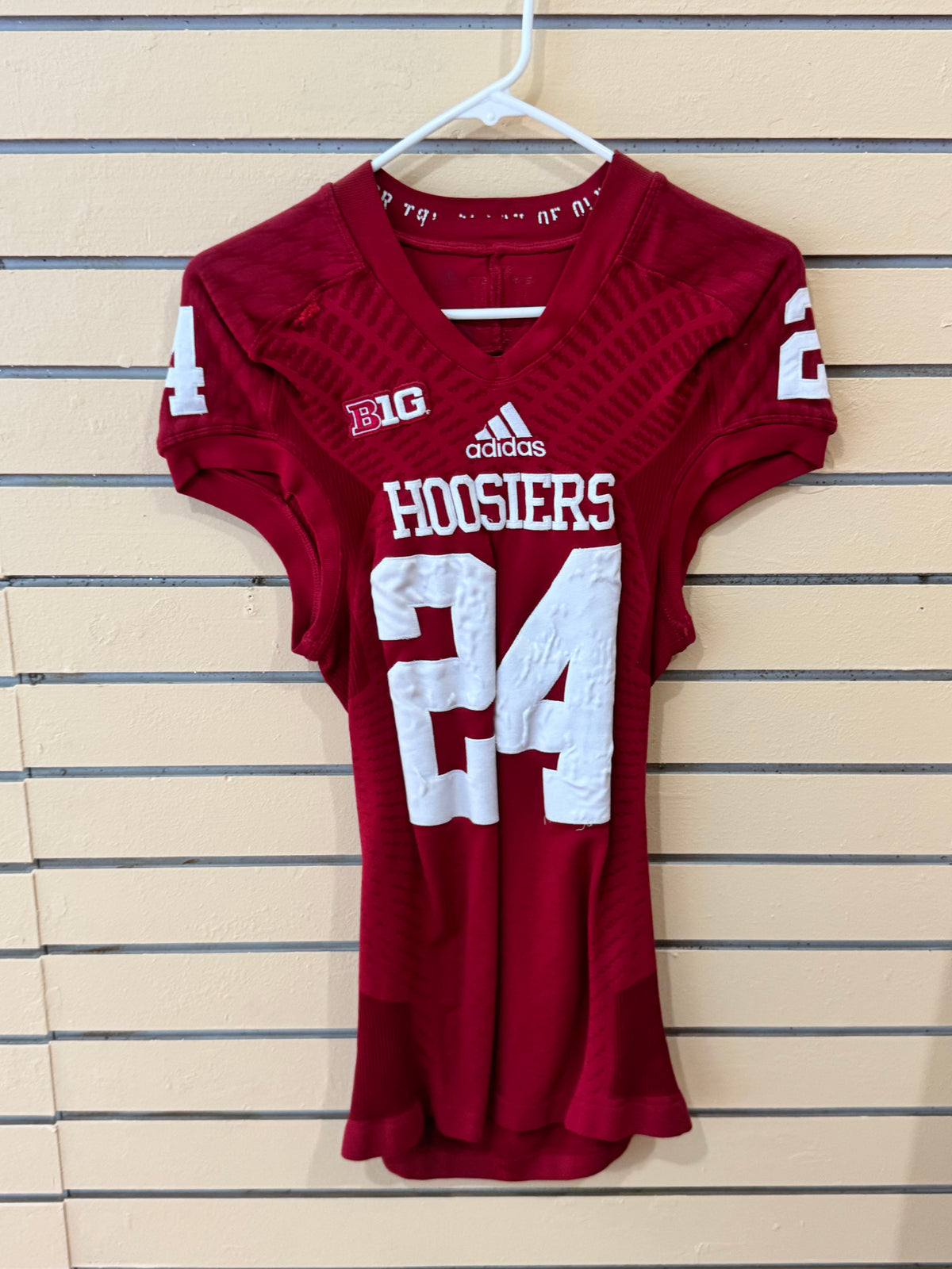 Red Adidas Indiana Hoosiers #24 game-used or team-issued tech-fit college football jersey with the Big Ten logo on the chest.