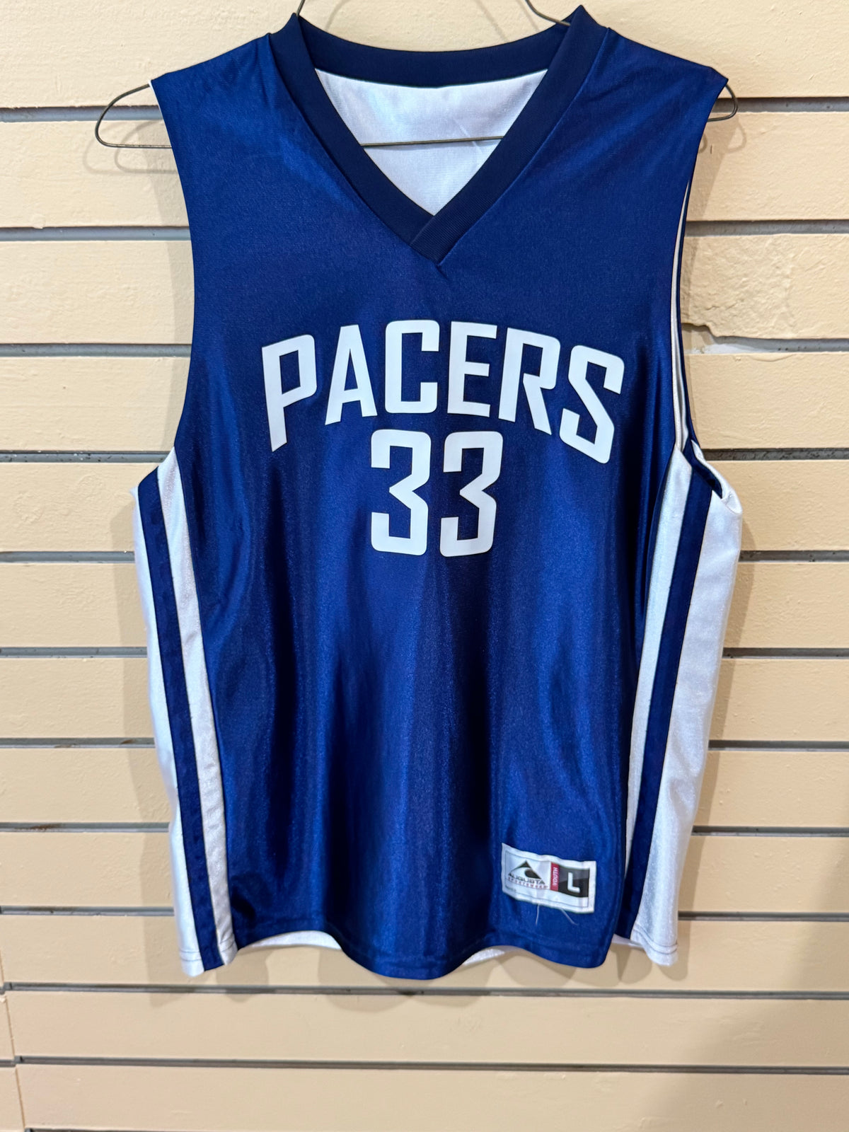 Royal Blue and White reversible youth basketball jersey size large featuring "PACERS 33,"