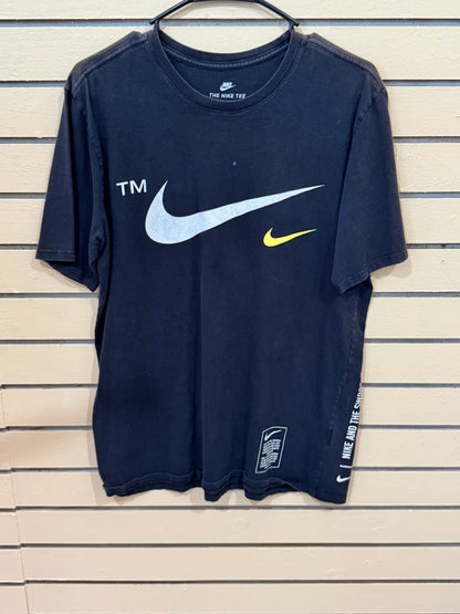 black Nike t-shirt features a large white swoosh logo size medium