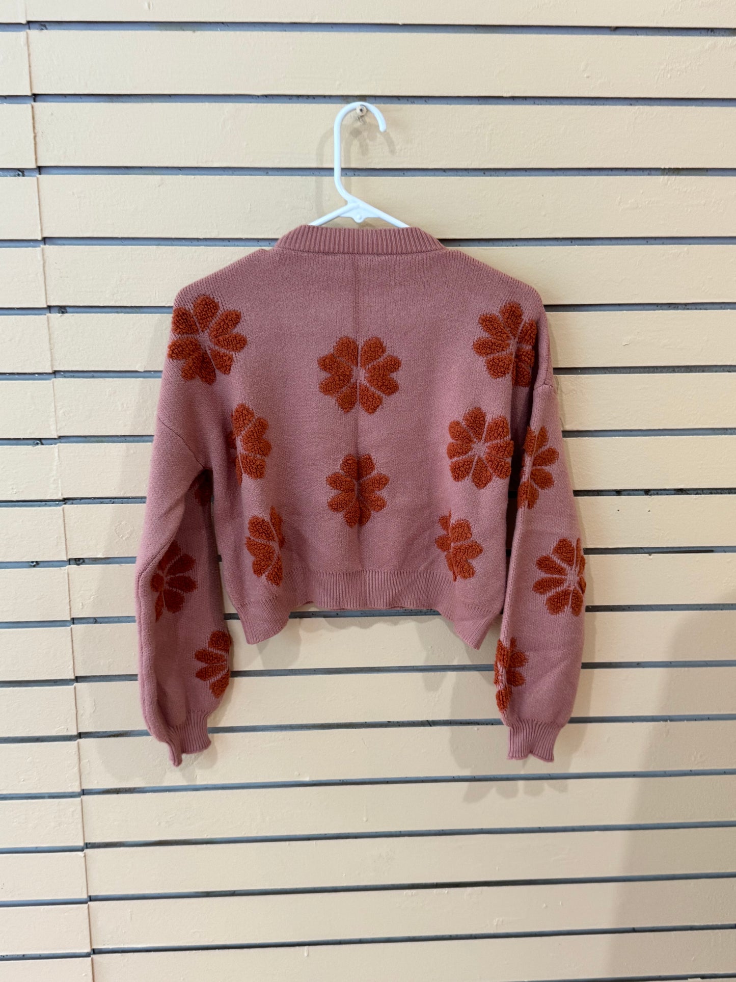 Simply Southern brand women’s Floral Rust Cropped Sweater size large featuring a dusty pink knit fabric and dark orange flower motifs.