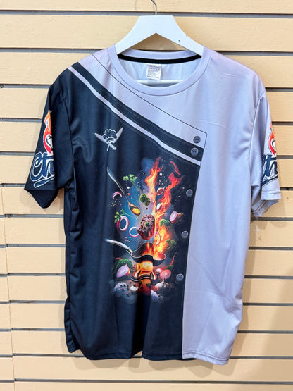 Novelty short-sleeve chef coat graphic t-shirt size Large featuring a 3D-printed black-and-grey faux double-breasted jacket design with a flaming culinary pan graphic