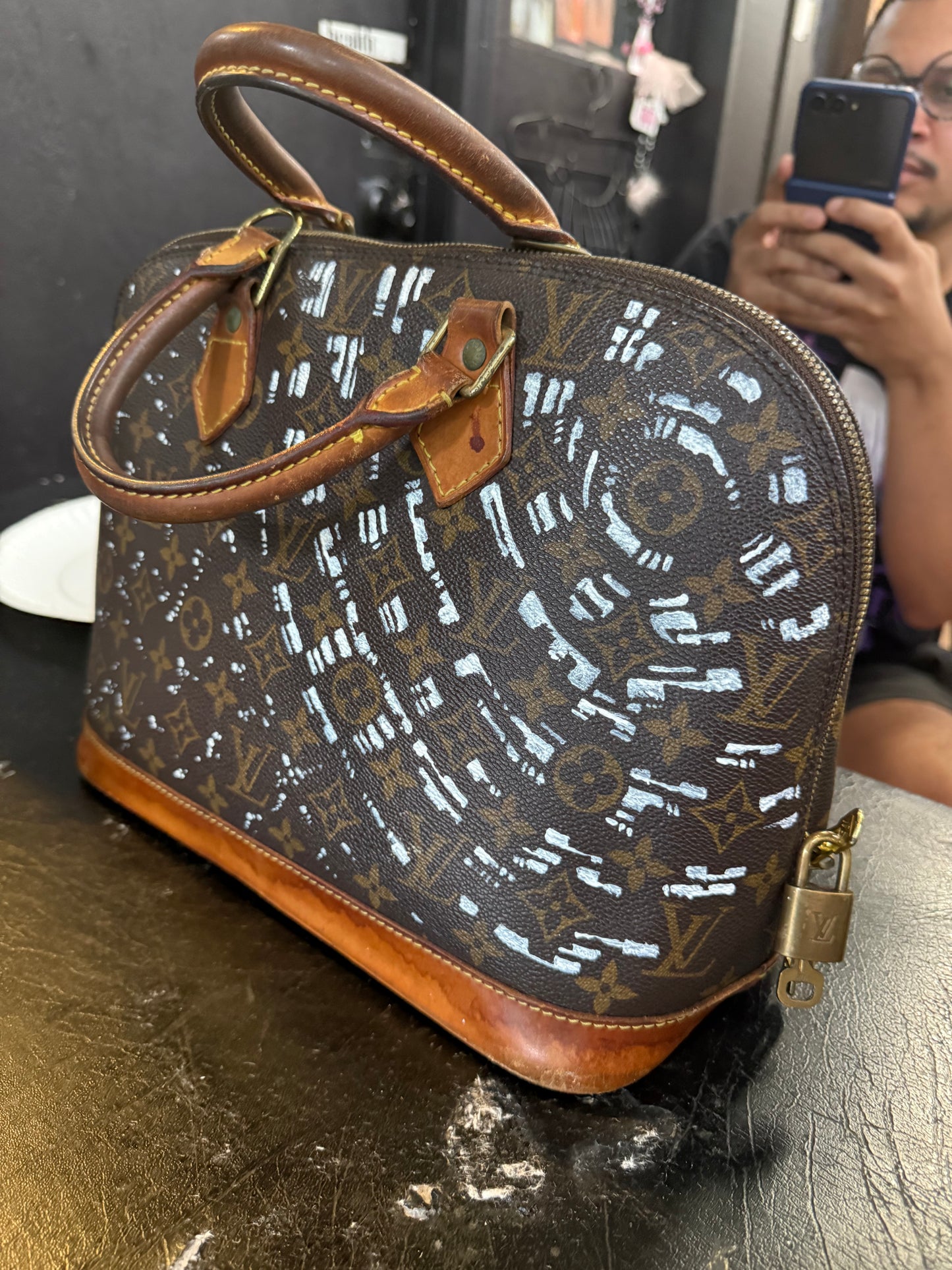 The Custom Authentic 1 of 1 Louis Vuitton Monogram Alma handbag is a luxurious and iconic piece