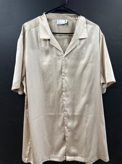 ASOS DESIGN short-sleeve satin camp-collar shirt in a smooth champagne hue.