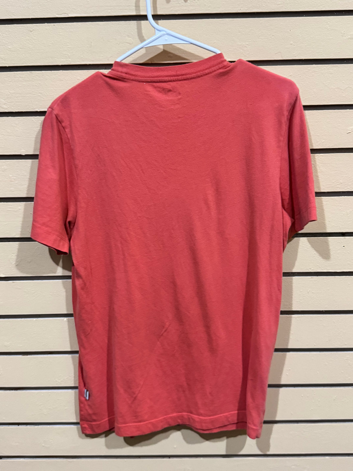 Puma Essentials Heather Men's Tee in High Risk Red size small featuring a large graphic logo on the chest.