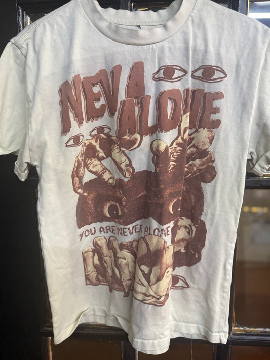 Neva Alone Cream-colored Short-sleeve Streetwear t-shirt featuring a "Neva Alone" graphic size small