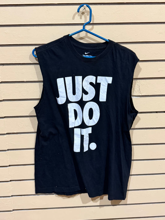 Nike Dry-FIT women's sleeveless tank top shirt featuring a large, white "JUST DO IT." graphic. Size medium