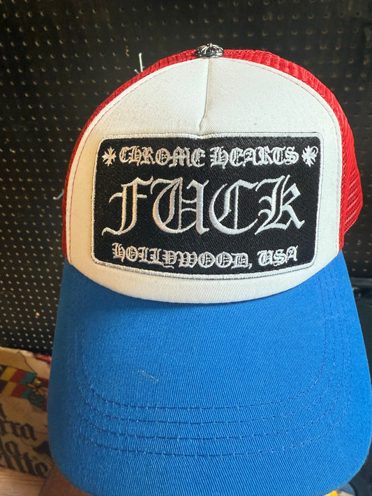 Chrome Hearts "FUCK" Hollywood trucker hat in a red, white, and blue colorway.