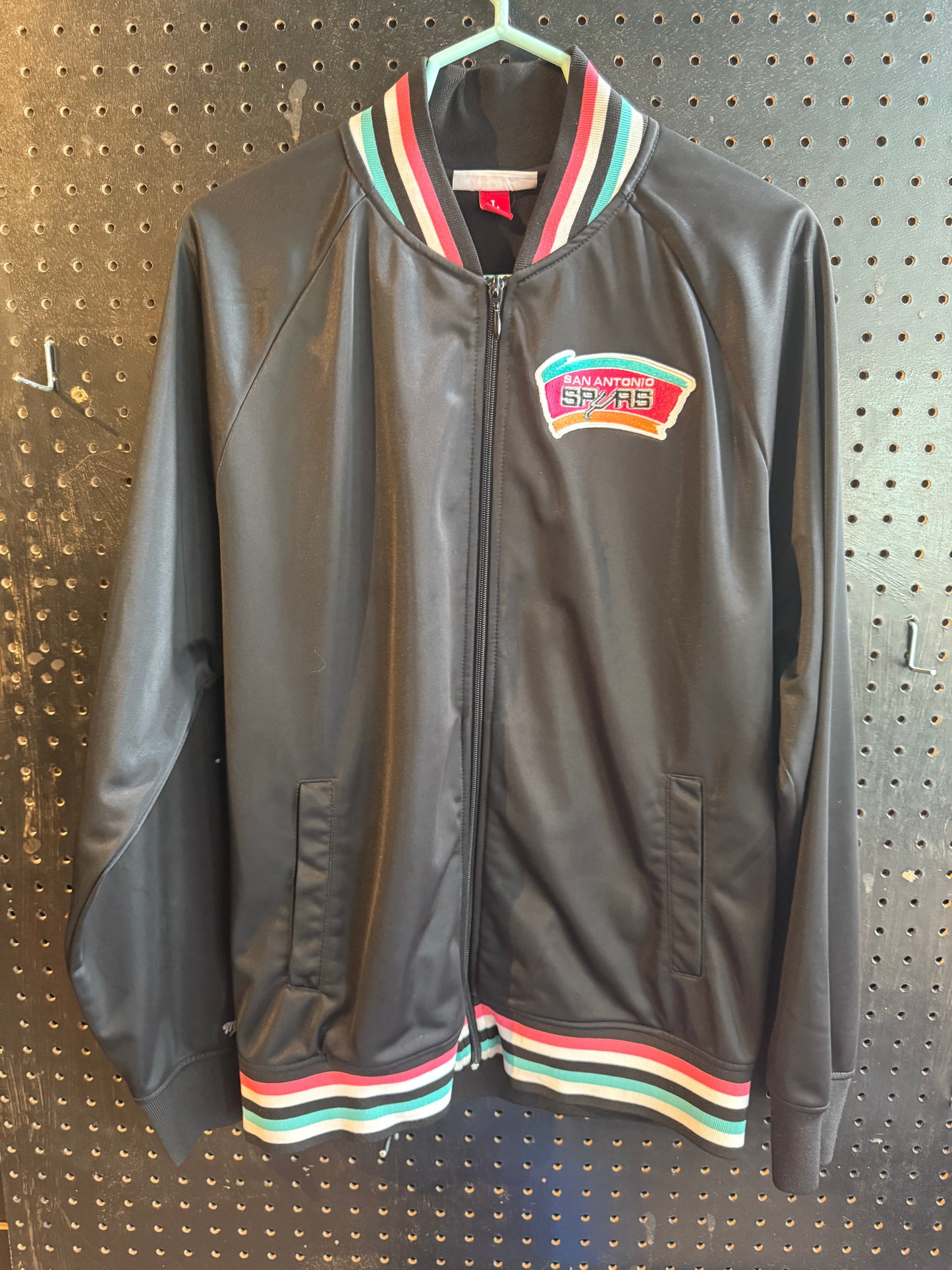 Mitchell & Ness San Antonio Spurs NBA jacket featuring a black finish and teal, pink, and white ribbed trim size large